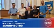 Пятеро мужчин с наградами в зале; внизу подпись Московско-Крымского землячества